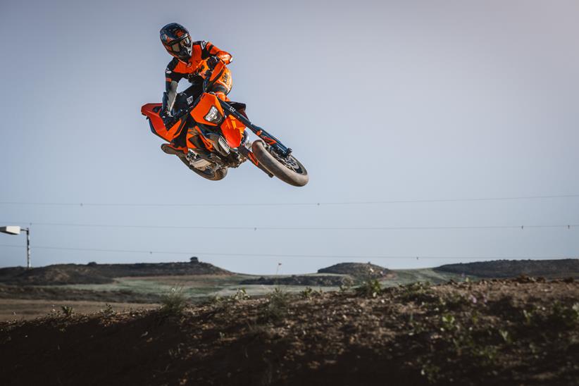 KTM 690 SMC R jumping on a dirt track