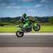 Jonny Davies performs a high chair wheelie in practice