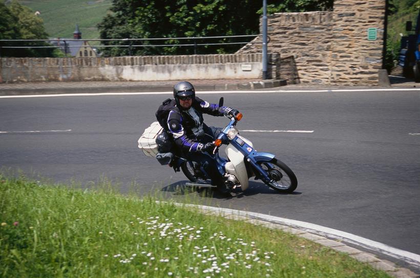 Honda C90 on the road