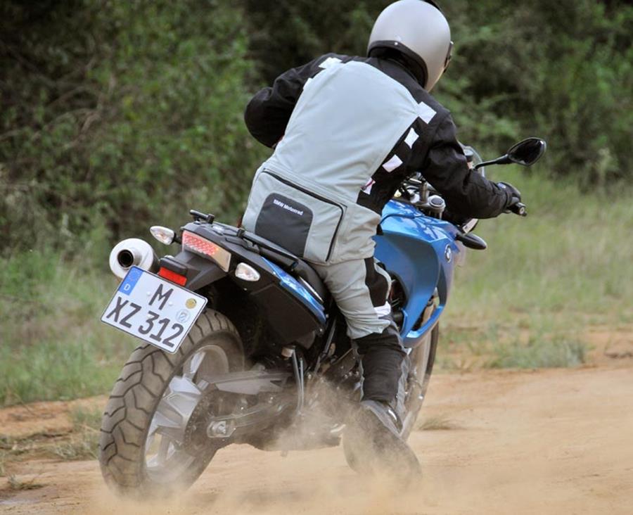 BMW F650GS ridden off-road on a dusty track very quickly