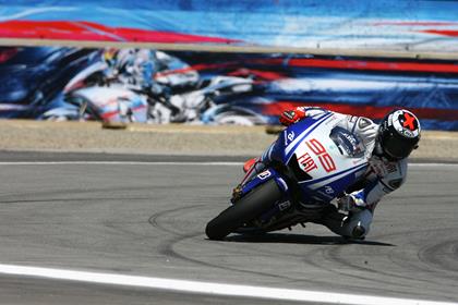 Lorenzo runs wide trying to pass Rossi for second