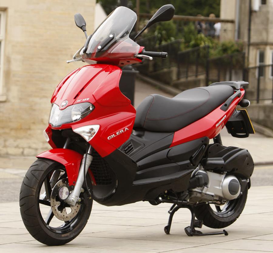 2009-2016 Gilera Runner 125 static shot of red bike with building back drop