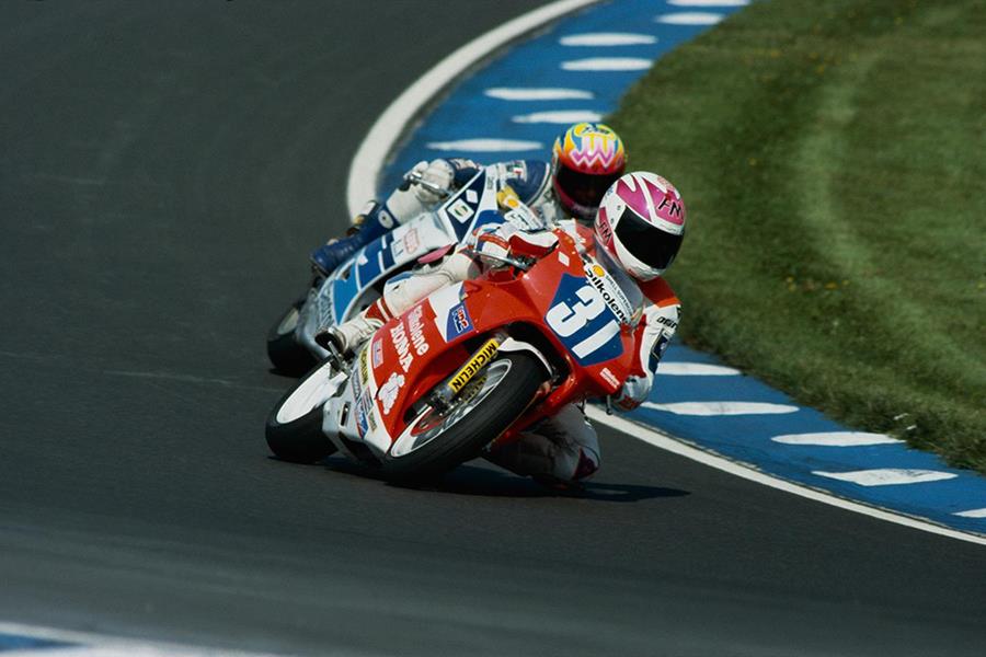 BSB star James Whitham on his Suzuki RGV250 race bike follows legend Carl Fogarty 