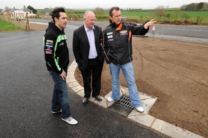 Riders Gary Mason and John McGuinness inspect the new chicane at Mather’s Cross with NW200 Race Director Mervyn Whyte MBE