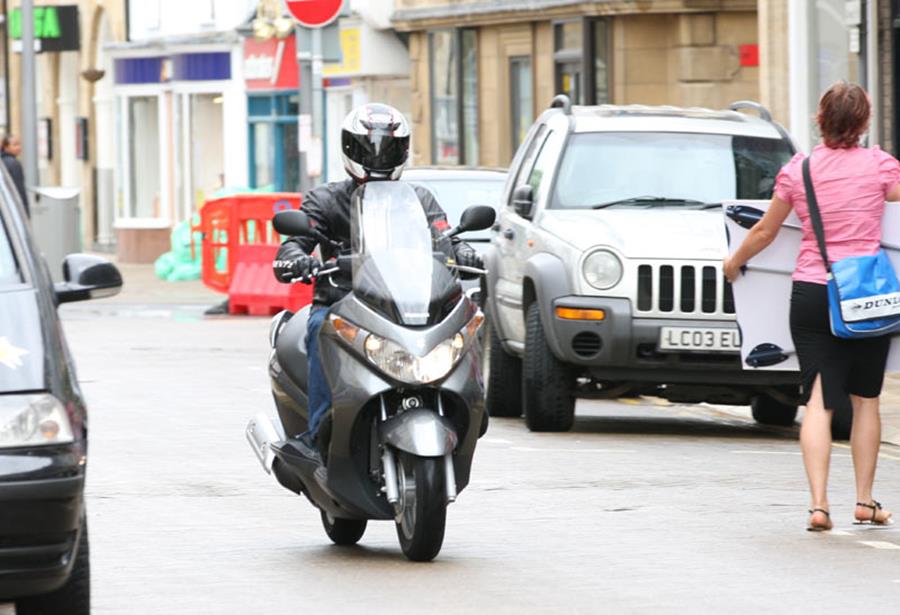 Suzuki Burgman 125 ridden on the street