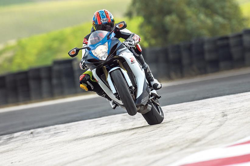 Putting a slip-on exhaust on new 2023 GSX-R750 during break-in