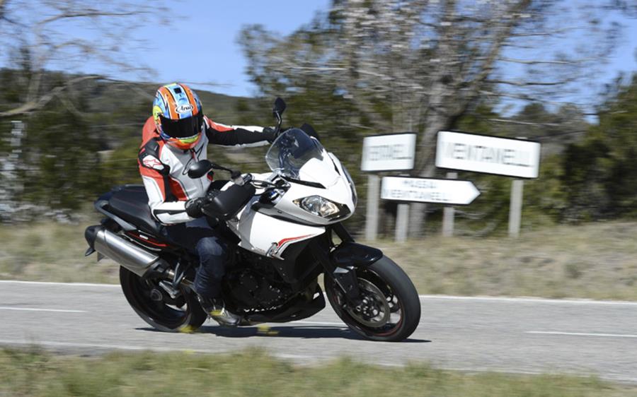 Triumph Tiger 1050 Sport ridden quickly around a corner