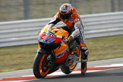 Stoner breaks laps record to take pole at Misano