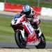 Checa secures race one win