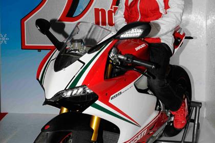 Valentino Rossi poses with a 1199 Panigale but no GP12