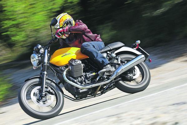 Moto Guzzi V7 Stone side profile riding shot