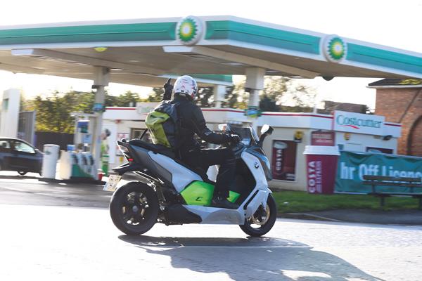 BMW C evolution and its rider Liam putting his finger up at an innocent BP garage