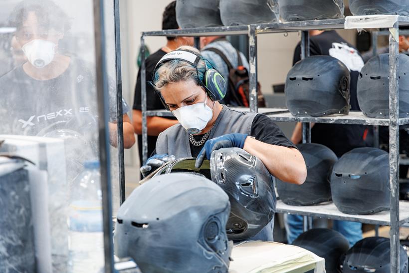 Worker sanding the shell