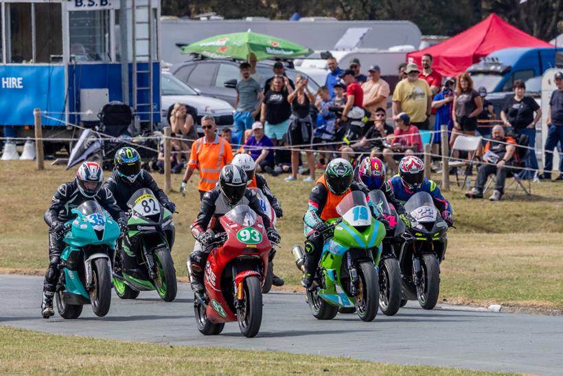 Spectators watch riders leave the start line at Tonfanau. Credit: David Glover