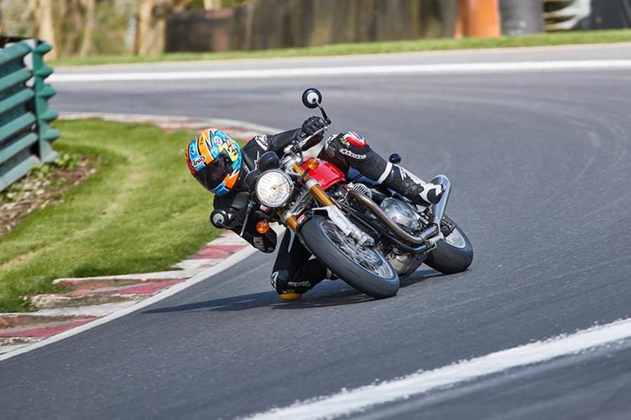 Triumph Thruxton R cornering hard on track with knee down