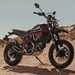 A side view of the Ducati Scrambler Desert Sled Fasthouse