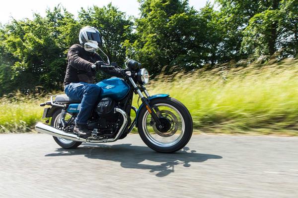 Moto Guzzi V7 Special riding down a country road