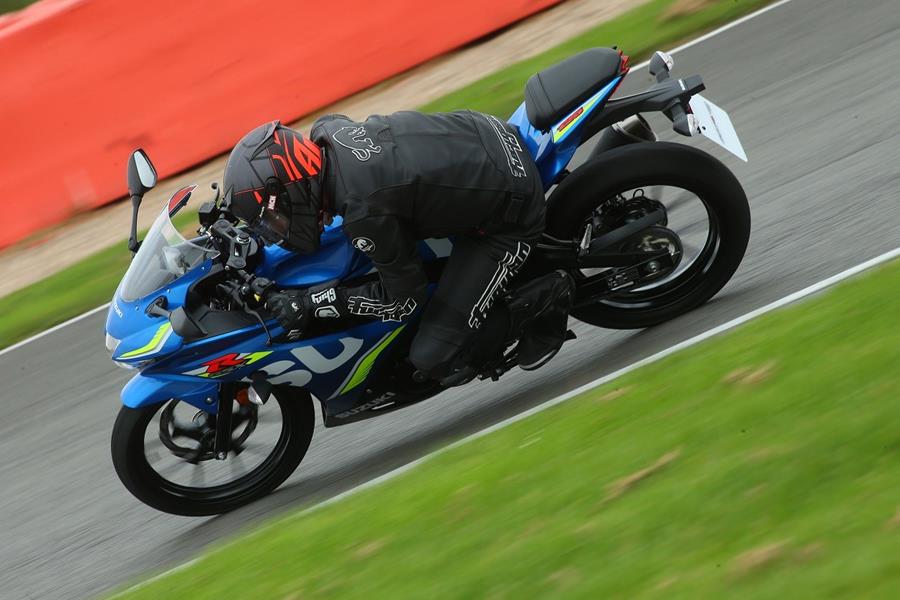 Suzuki GSX-R125 knee down on track overhead shot