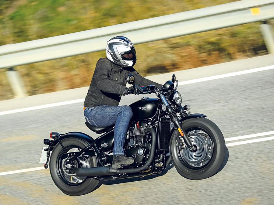 Triumph Bonneville Bobber Black action riding shot