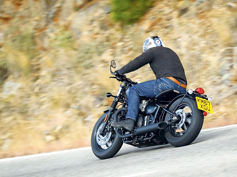 Triumph Bonneville Bobber Black rear riding shot tail