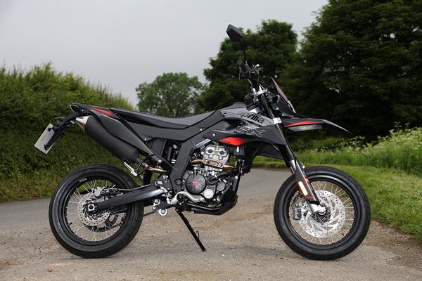 Aprilia SX125's suicide side stand retracts on a spring