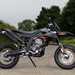 Aprilia SX125's suicide side stand retracts on a spring