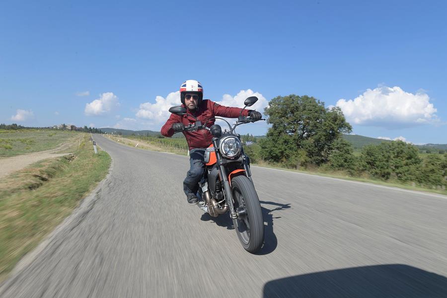 Open face helmets are the order of the day on a Ducati Scrambler