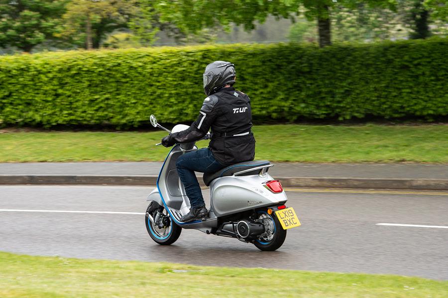 Electric Vespa Elettrica on the road rear