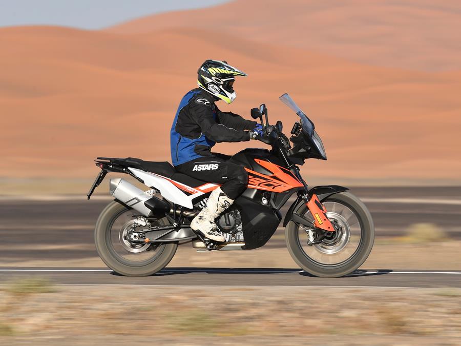 KTM 790 Adventure side profile on desert with dust