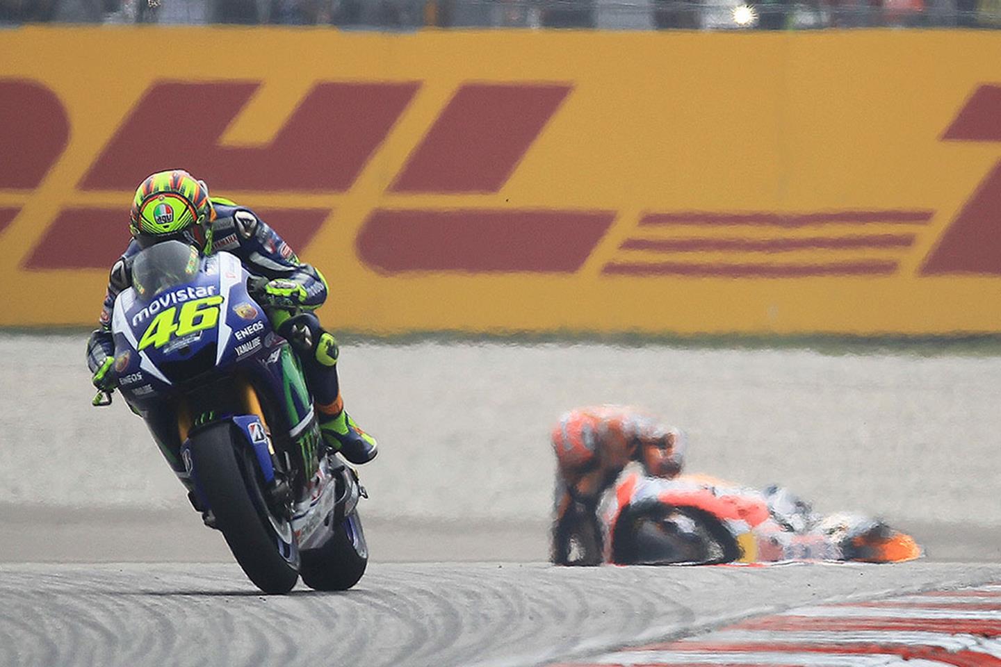 valentino rossi kicks marquez