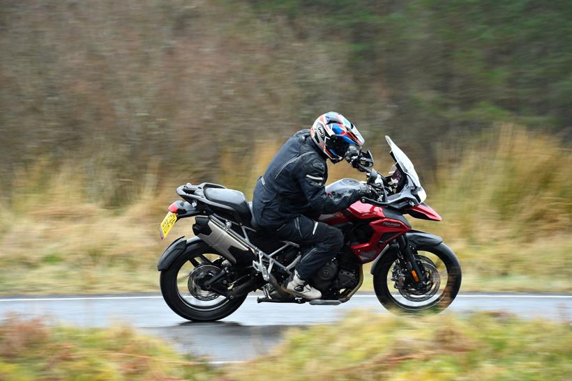 Rival bike Triumph Tiger 1200 GT Pro, navigating wet conditions