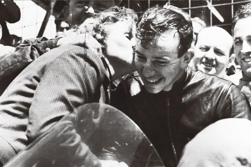 John Surtees gets a kiss from his mother after his first TT win