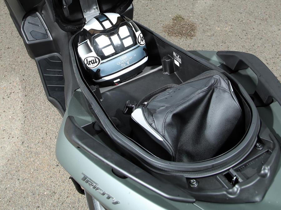 The Yamaha Tricity 300 can fit two helmets under the seat