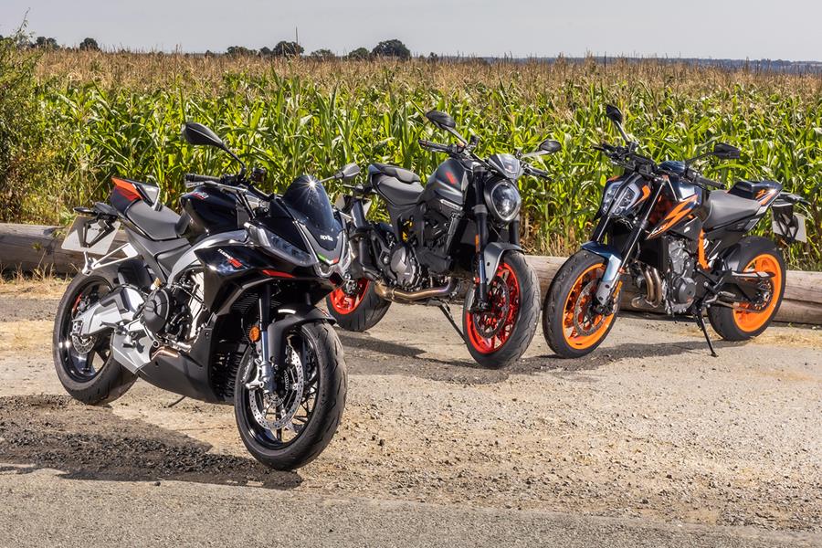 Aprilia Tuono 660 Factory, Ducati Monster and KTM 890 Duke R parked in a row