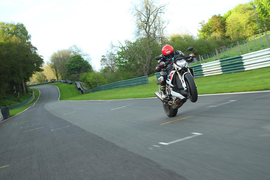 Pulling a wheelie on the BMW S1000R at Cadwell Park