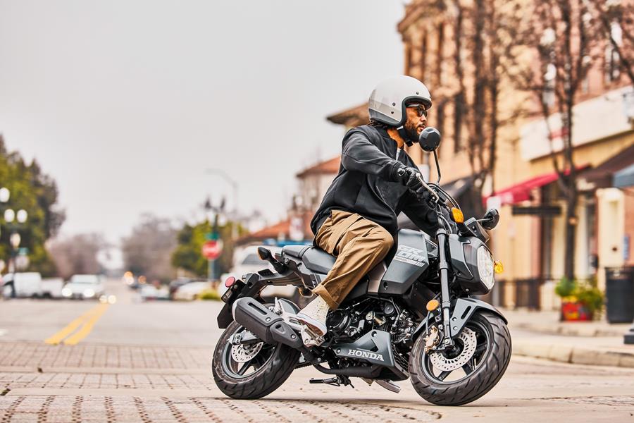 2024 Honda MSX125 Grom in 'matte black metallic' riding through town