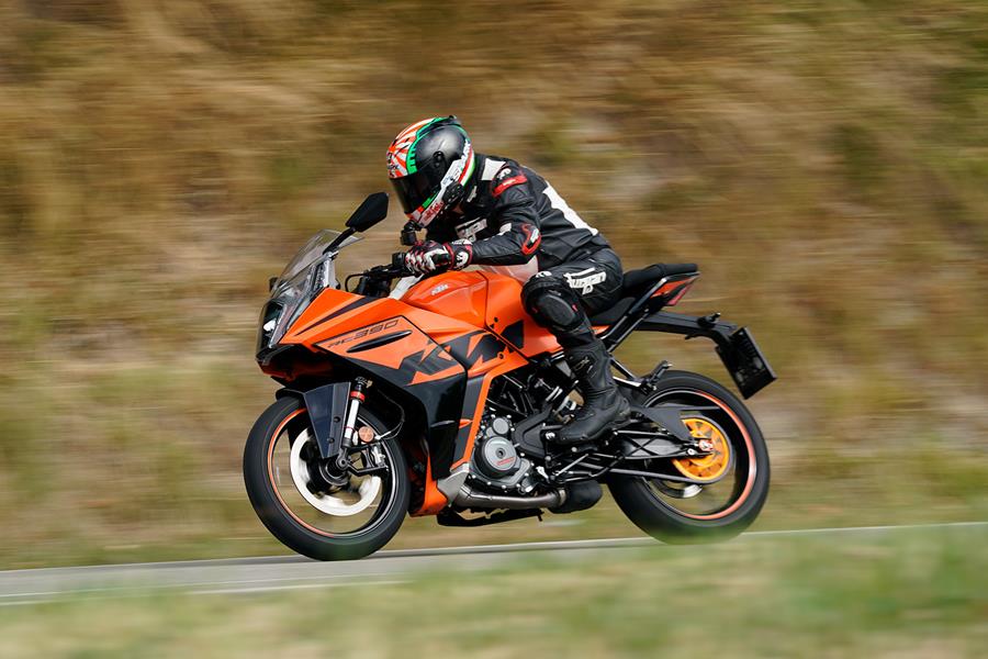 Tucked in on the 2022 KTM RC 390 riding at speed on the road