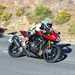 Triumph Speed Triple 1200 RR on the road turning left