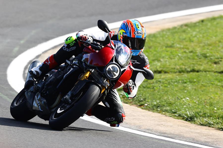 Triumph Speed Triple 1200 RR on the track left turn