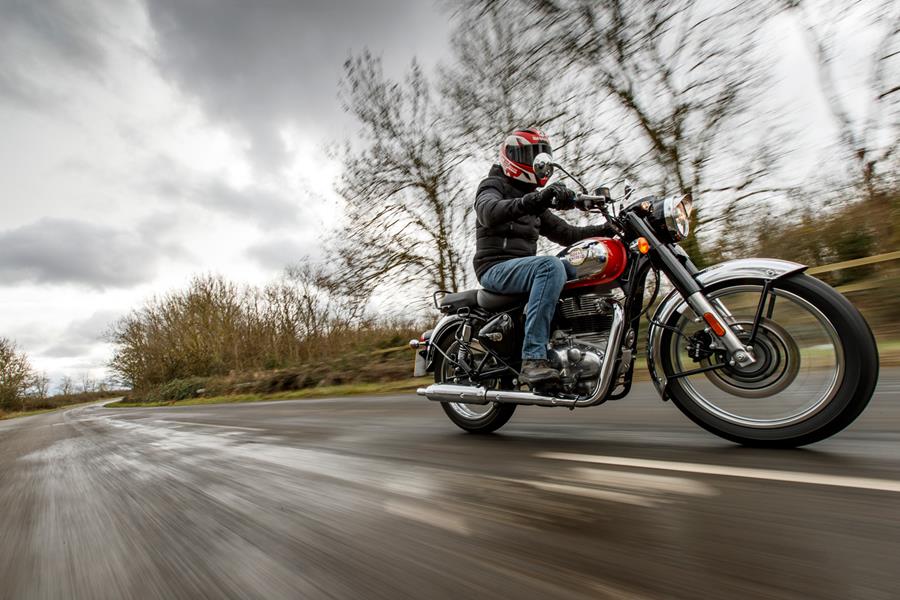 Riding the 2022 Royal Enfield Classic 350 on a straight UK road