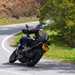 A rear riding shot of the 2022 Triumph Tiger 1200 GT Pro