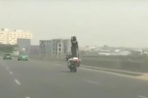 Video: Officer dances while riding (standing) on bike seat