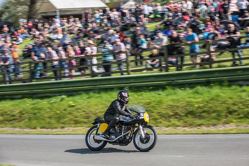 A rider races up the hill