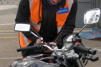 Instructor Mark Wiseman checks over the Suzuki SV650 after the little visit to the ground