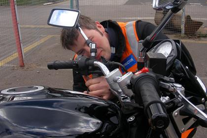 Instructor Mark Wiseman changes the clutch lever on the Suzuki SV650