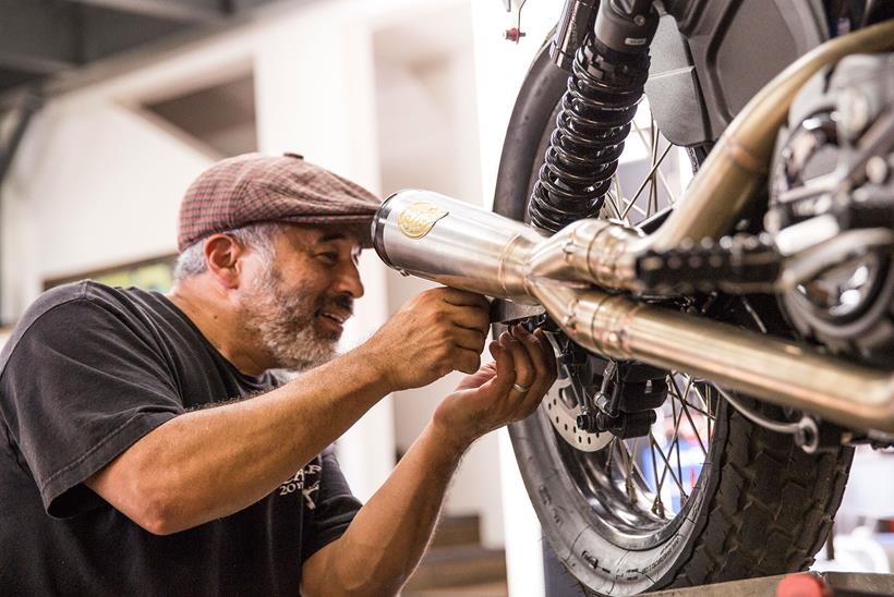 Caballero working on his bike