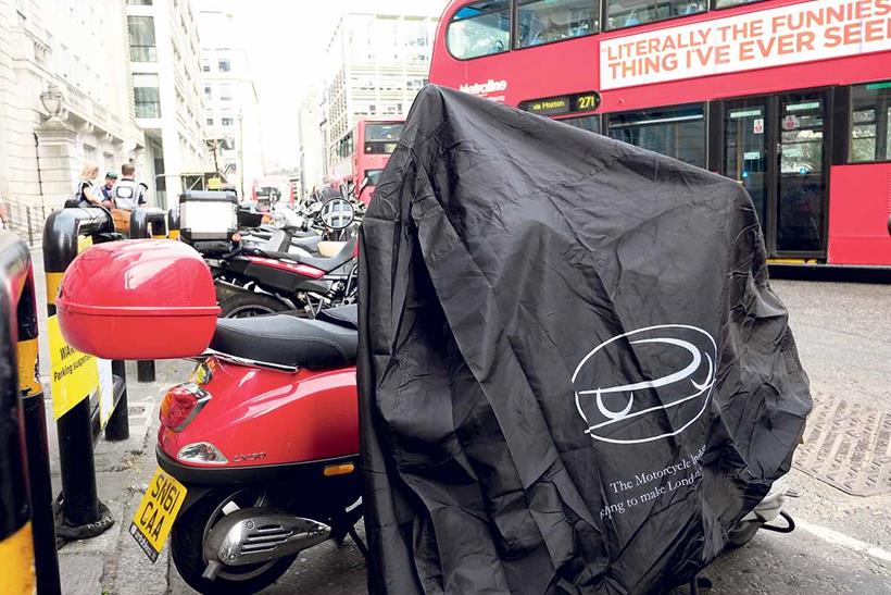 Free motorbike covers handed out in London