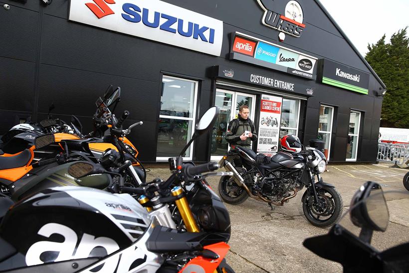 Dan looks over the Suzuki SV650X with a coffee