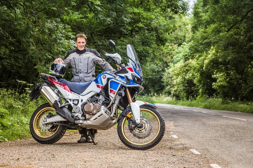 MCN's Michael Guy stands with his Africa Twin