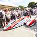 TT winners Ben and Tom Birchall wheel their sidecar through the pits
